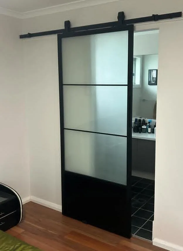 15 Modern Farmhouse Bathroom Ideas That Bring Rustic Charm & Modern Comfort 6 Farmhouse Sliding Barn Door