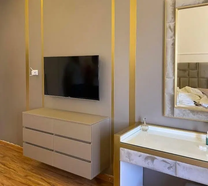 Living Room TV Wall Ideas: 20 Stunning, Modern & Pinterest-Trendy Designs for Every Home 10 Dark Accent Wall with Gold Detailing