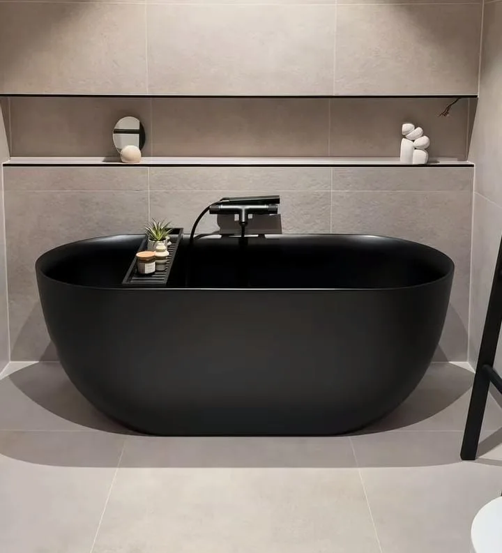 Black Freestanding Tub with Gold Fixtures
